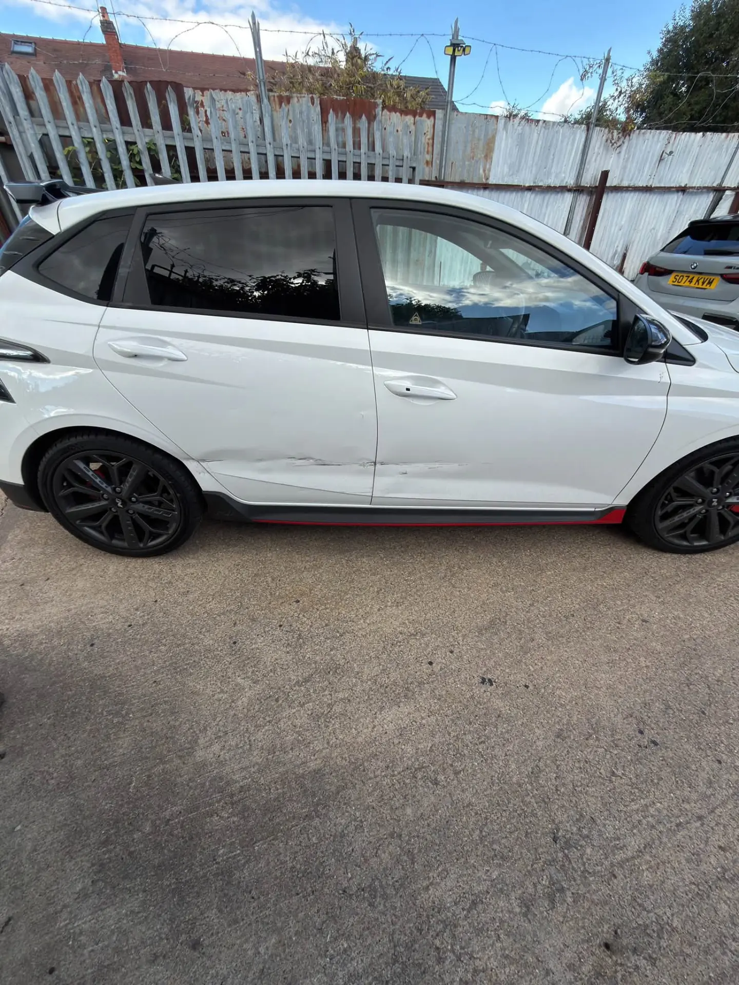 White Hyundai i20 N side profile after repair